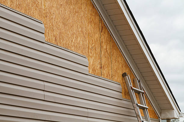 Professional Emergency Siding Repair technician working in Williamsfield, OH